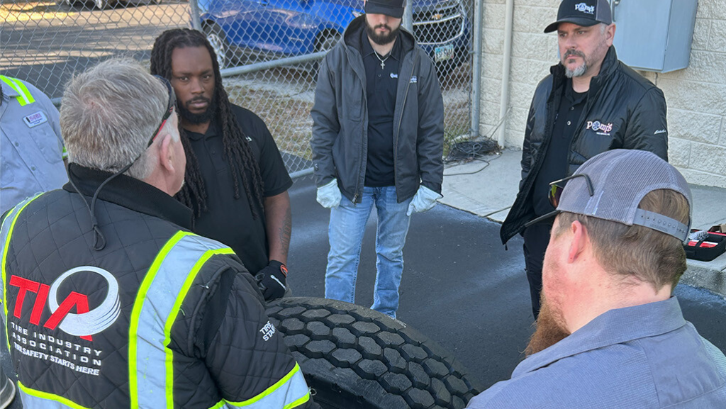 TIA Training CTS class in Brooksville, Florida with people standing around a large commercial tire and the instructor, Matt White.